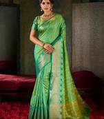 Mint green and emerald silk saree with traditional gold zari accents