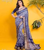 Navy blue floral batik saree with antique zari border