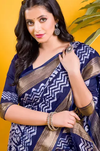 Navy blue floral batik saree with antique zari border
