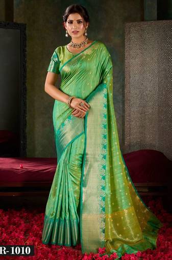 Mint green and emerald silk saree with traditional gold zari accents
