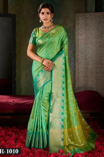 Mint green and emerald silk saree with traditional gold zari accents