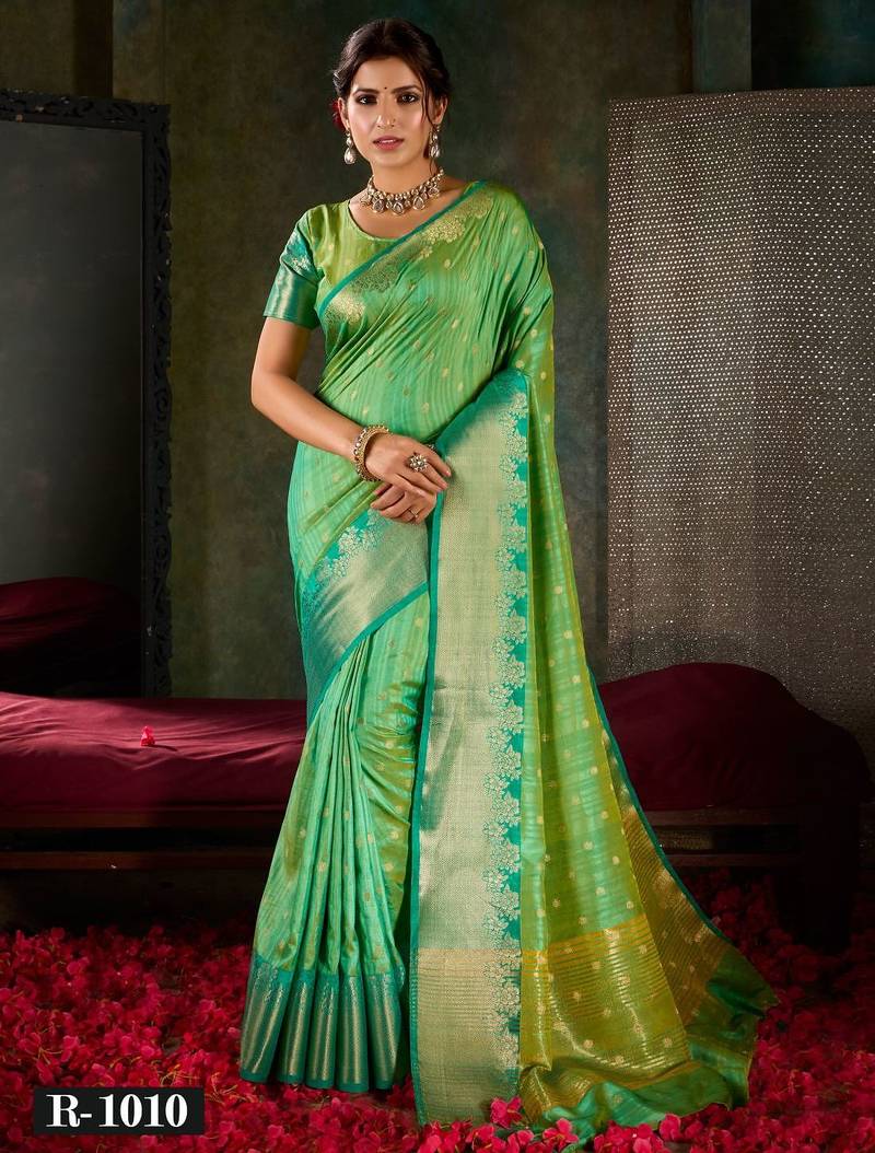 Mint green and emerald silk saree with traditional gold zari accents