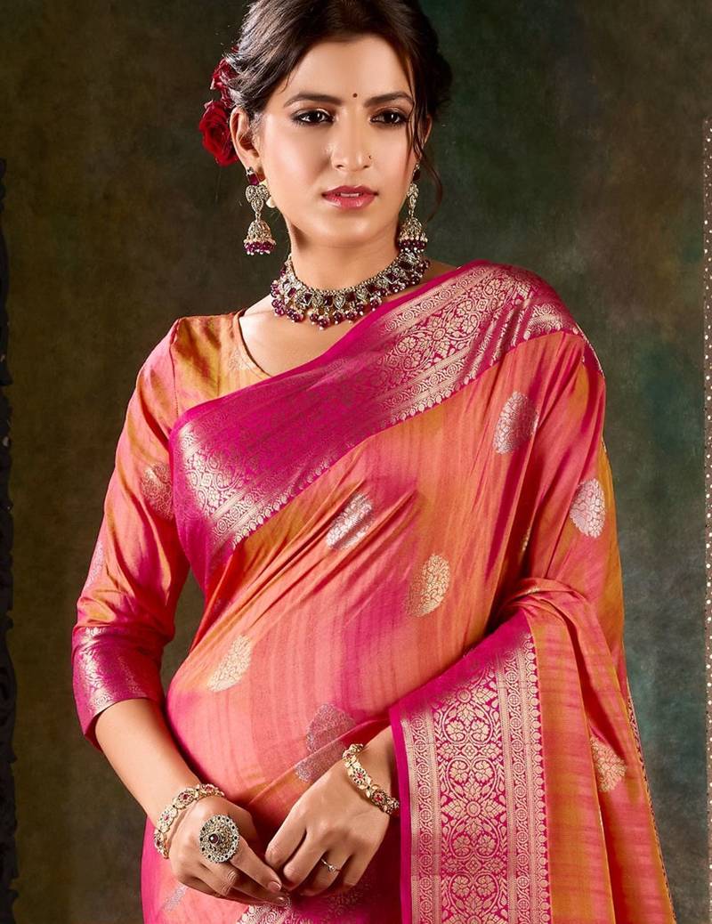 Vibrant pink and orange banarasi silk saree with traditional floral zari