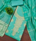 Elegant green woven zari unstitched salwar suit with dupatta