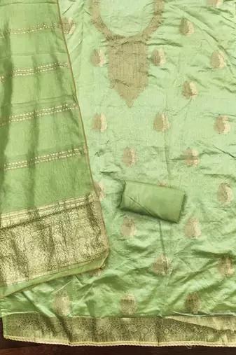 Elegant light green zari woven unstitched salwar suit with dupatta