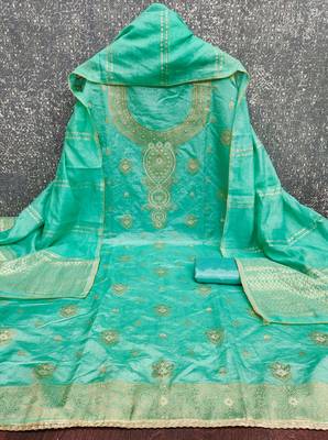 Elegant green woven zari unstitched salwar suit with dupatta 2