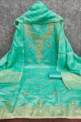 Elegant green woven zari unstitched salwar suit with dupatta