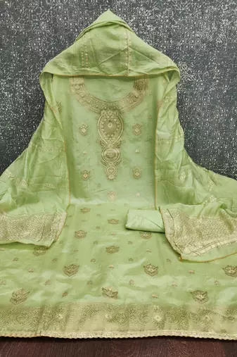 Elegant light green woven zari unstitched salwar suit with dupatta