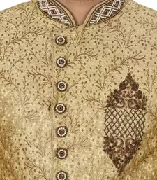 Gold straight pattern work on zari jamewar fabric with hand work on collar ,hand and front indo western