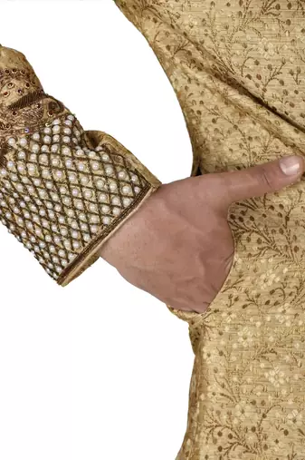 Gold straight pattern work on zari jamewar fabric with hand work on collar ,hand and front indo western