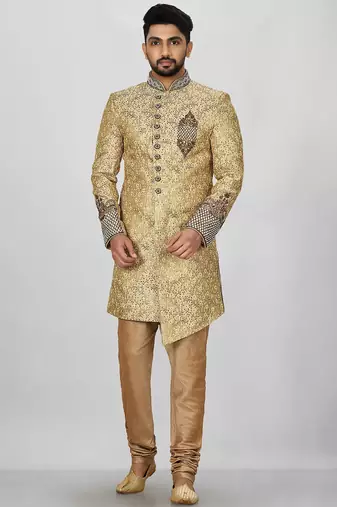 Gold straight pattern work on zari jamewar fabric with hand work on collar ,hand and front indo western