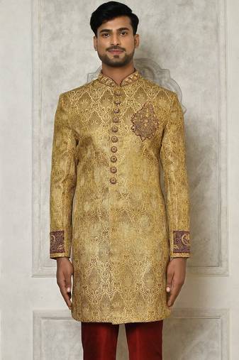 Gold straight pattern work on zari jamewar fabric with hand work on collar ,hand and front indo western