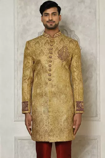 Gold straight pattern work on zari jamewar fabric with hand work on collar ,hand and front indo western