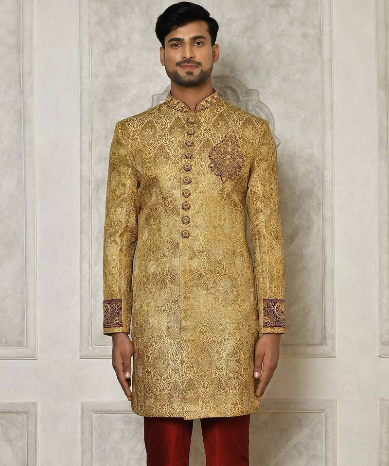 Gold straight pattern work on zari jamewar fabric with hand work on collar ,hand and front indo western