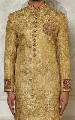 Gold straight pattern work on zari jamewar fabric with hand work on collar ,hand and front indo western 2