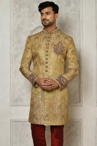 Gold straight pattern work on zari jamewar fabric with hand work on collar ,hand and front indo western