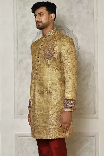 Gold straight pattern work on zari jamewar fabric with hand work on collar ,hand and front indo western
