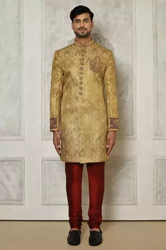 Gold straight pattern work on zari jamewar fabric with hand work on collar ,hand and front indo western