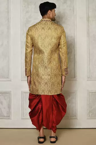 Gold straight pattern work on zari jamewar fabric with hand work on collar ,hand and front indo western