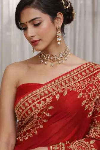 Red silk saree with gota patti jaal work, peacock motifs & heavy pallu