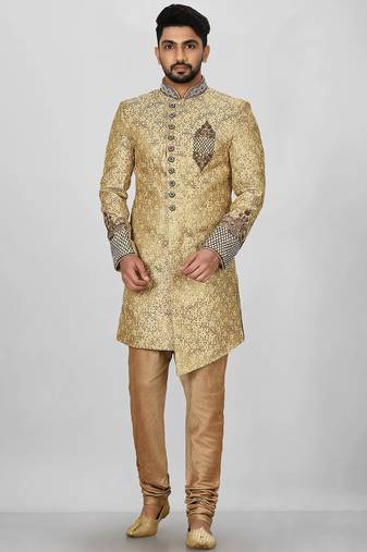 Gold straight pattern work on zari jamewar fabric with hand work on collar ,hand and front indo western