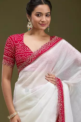 Women white embroidered tissue gold crush saree