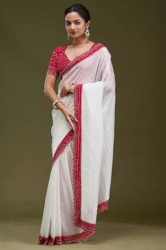 Women white embroidered tissue gold crush saree