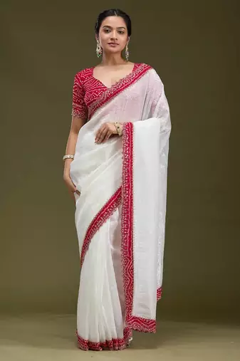 Women white embroidered tissue gold crush saree