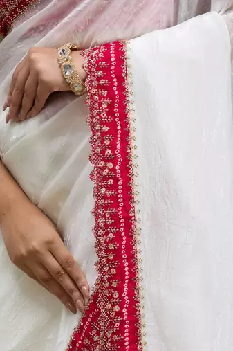 Women white embroidered tissue gold crush saree