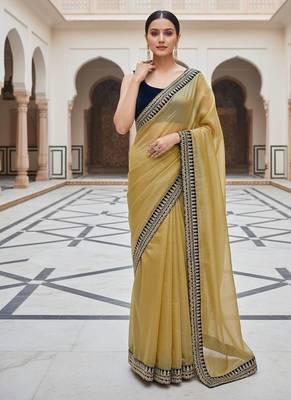 Women yellow embroidered soft twill net saree 2