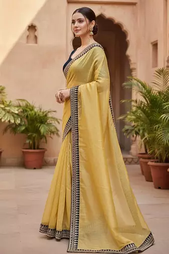 Women yellow embroidered soft twill net saree