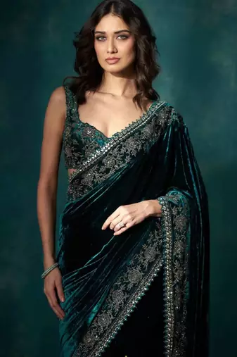Women green embroidered viscose velvet saree
