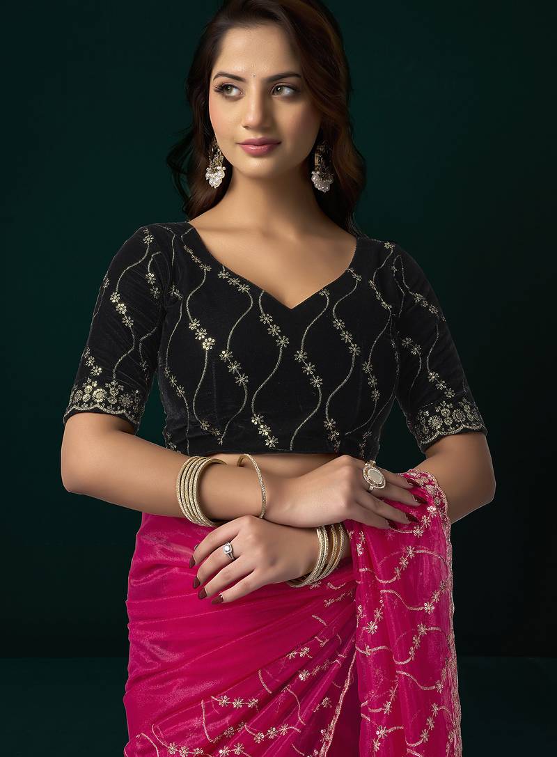 Women rani pink embroidered net saree