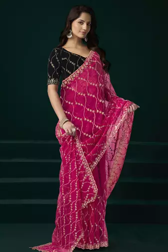 Women rani pink embroidered net saree