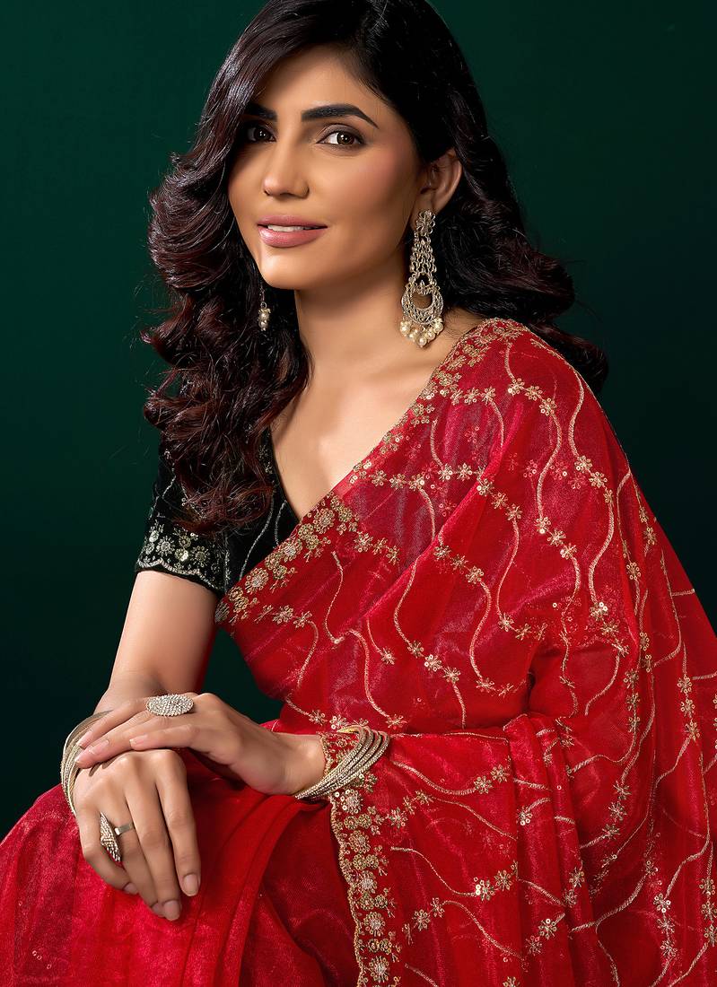 Women red embroidered net saree