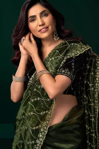 Women green embroidered net saree