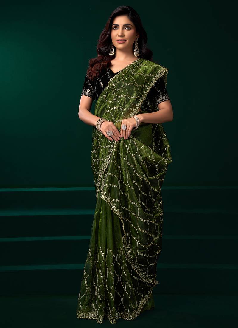 Women green embroidered net saree