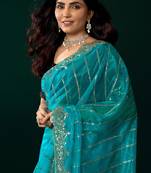 Women turquoise blue embroidered net saree
