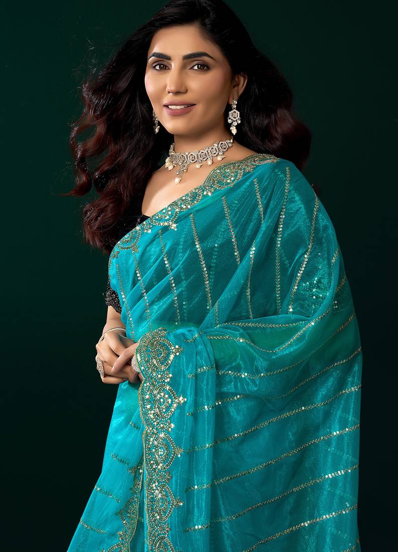 Women turquoise blue embroidered net saree