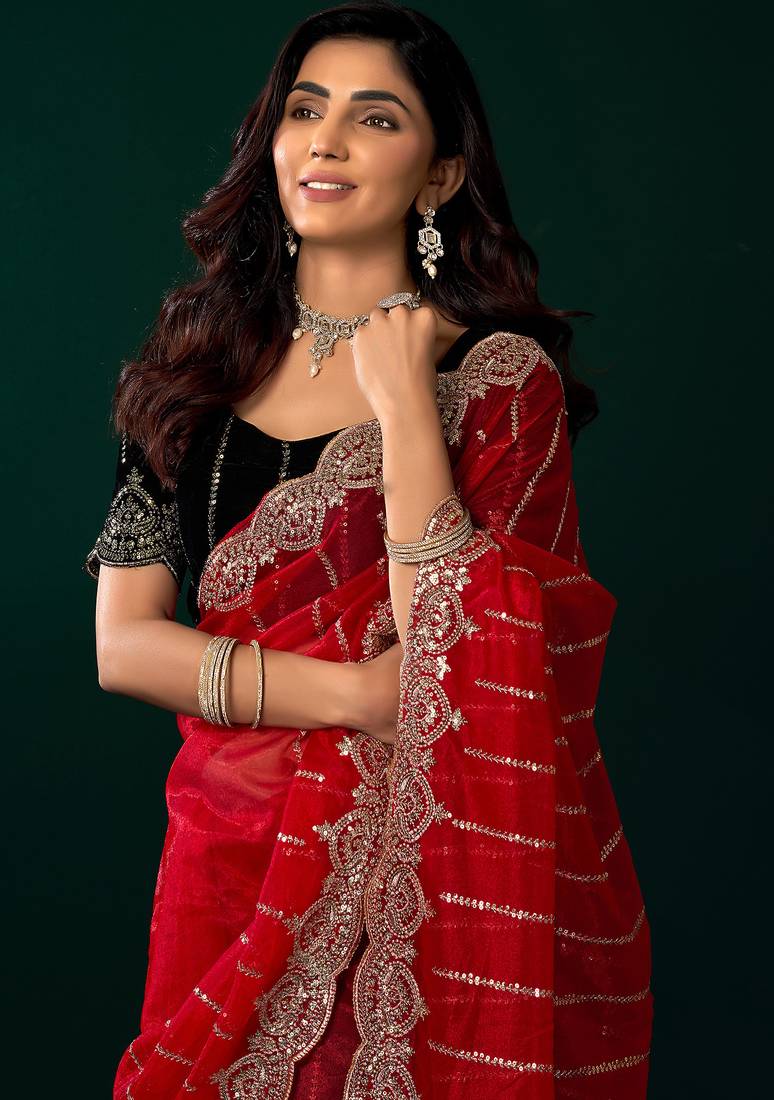 Women red embroidered net saree