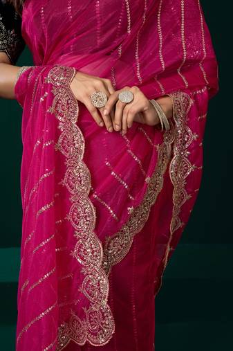 Women rani pink embroidered net saree