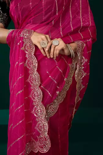 Women rani pink embroidered net saree