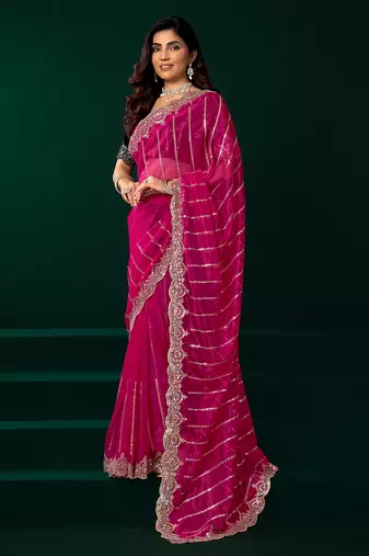 Women rani pink embroidered net saree