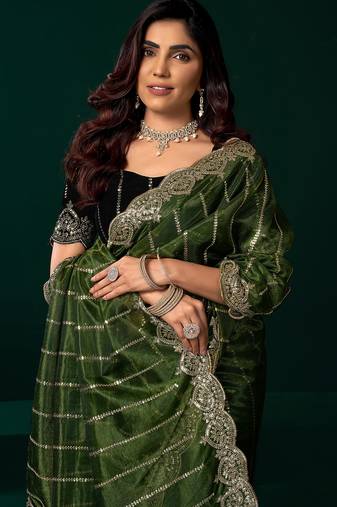 Women green embroidered net saree