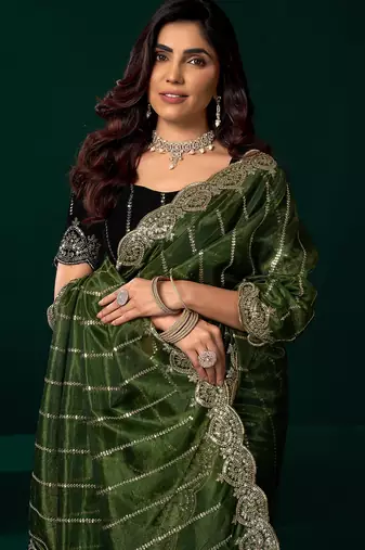 Women green embroidered net saree