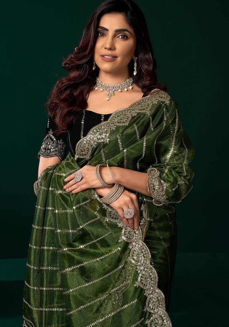 Women green embroidered net saree