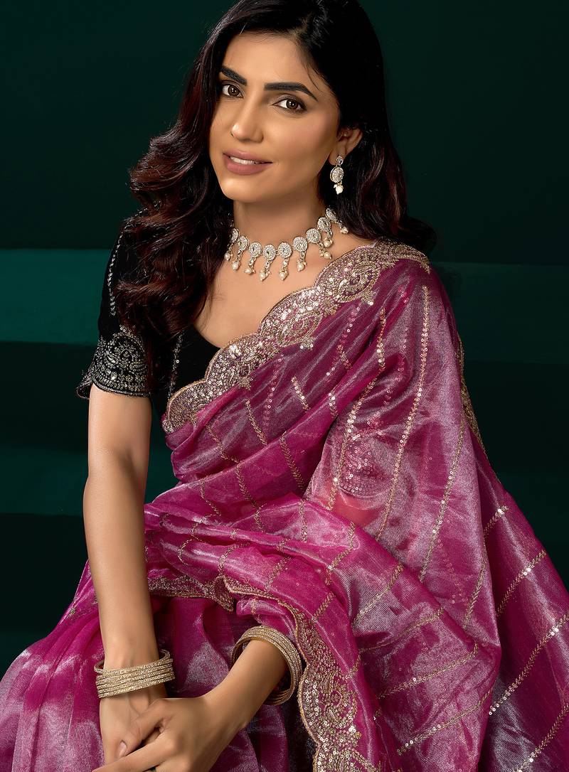 Women pink embroidered net saree