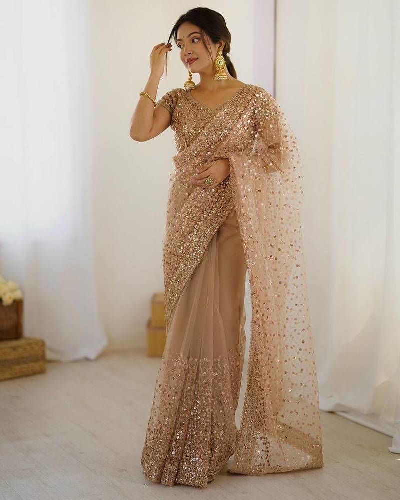 Beige net embroidered saree