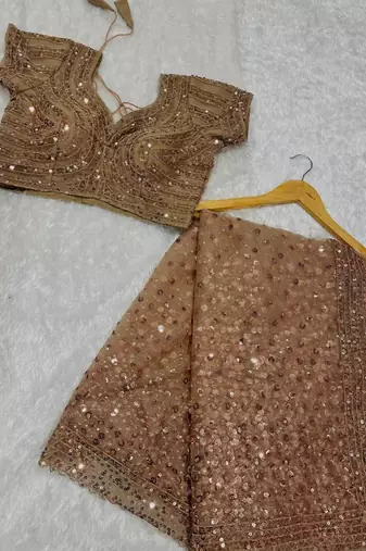 Beige net embroidered saree
