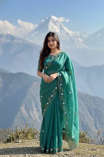 Teal Color hand khatli And cutdana butta and heavy border aarco Silk Saree